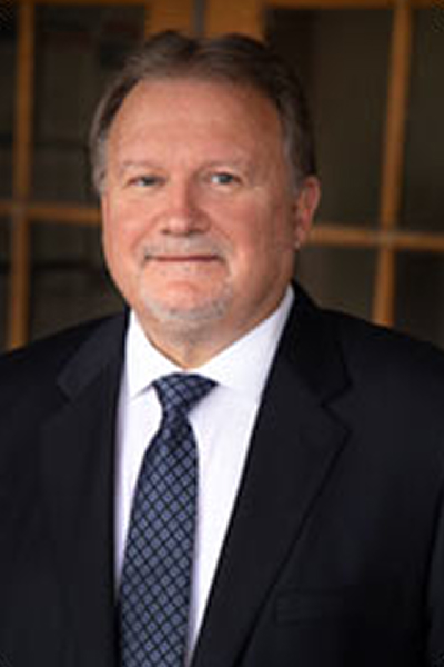 headshot of Brett Stephens