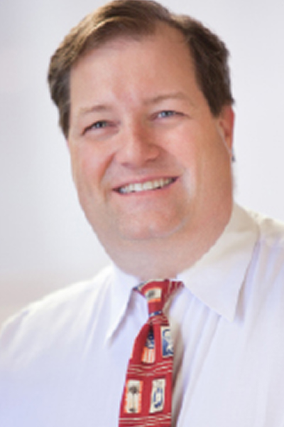 headshot of Christopher May